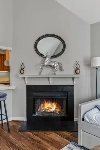 a living room with a fireplace and a fireplace