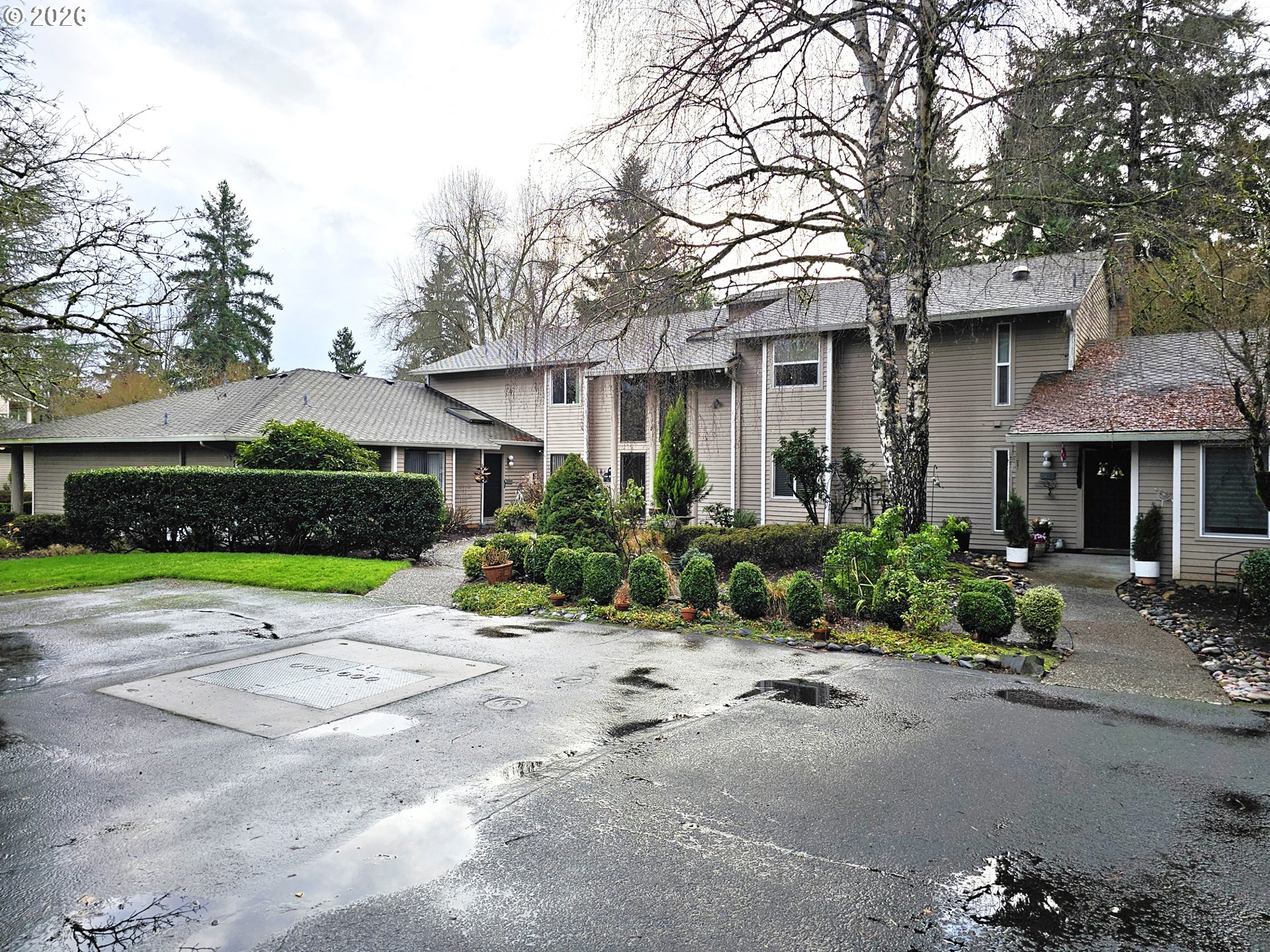 a front view of a house with a yard and a garage