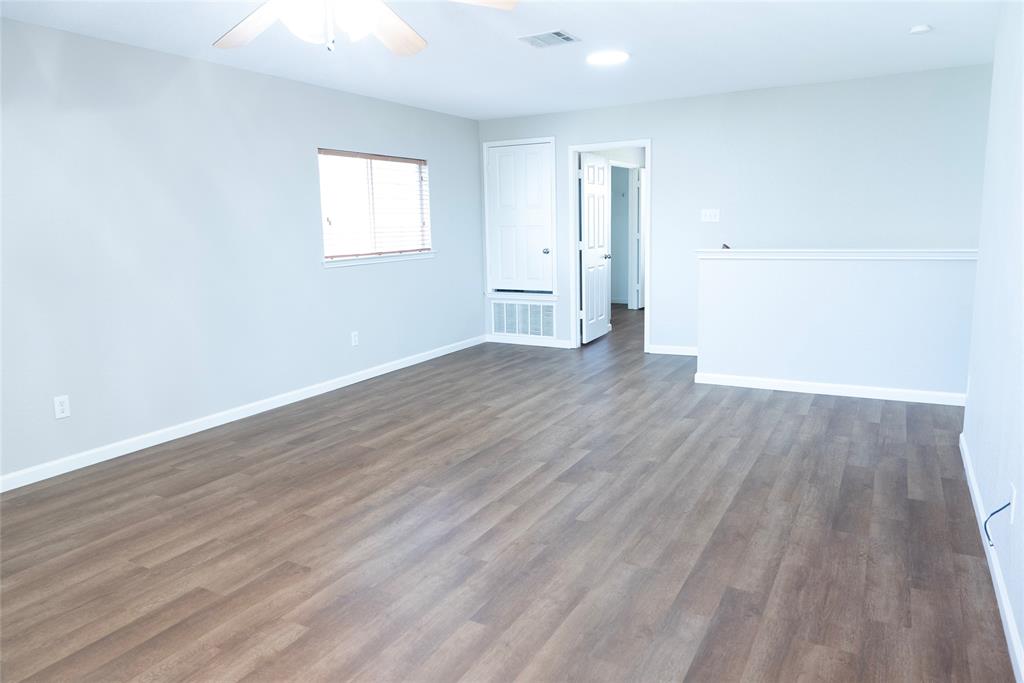 8805 Graywolf Ridge Trail Fort Worth, TX 76244 - Photo 18 of 23 Spacious interior room featuring wood-finish flooring, light neutral wall tones, a window with horizontal blinds, a ceiling fan, and recessed lighting