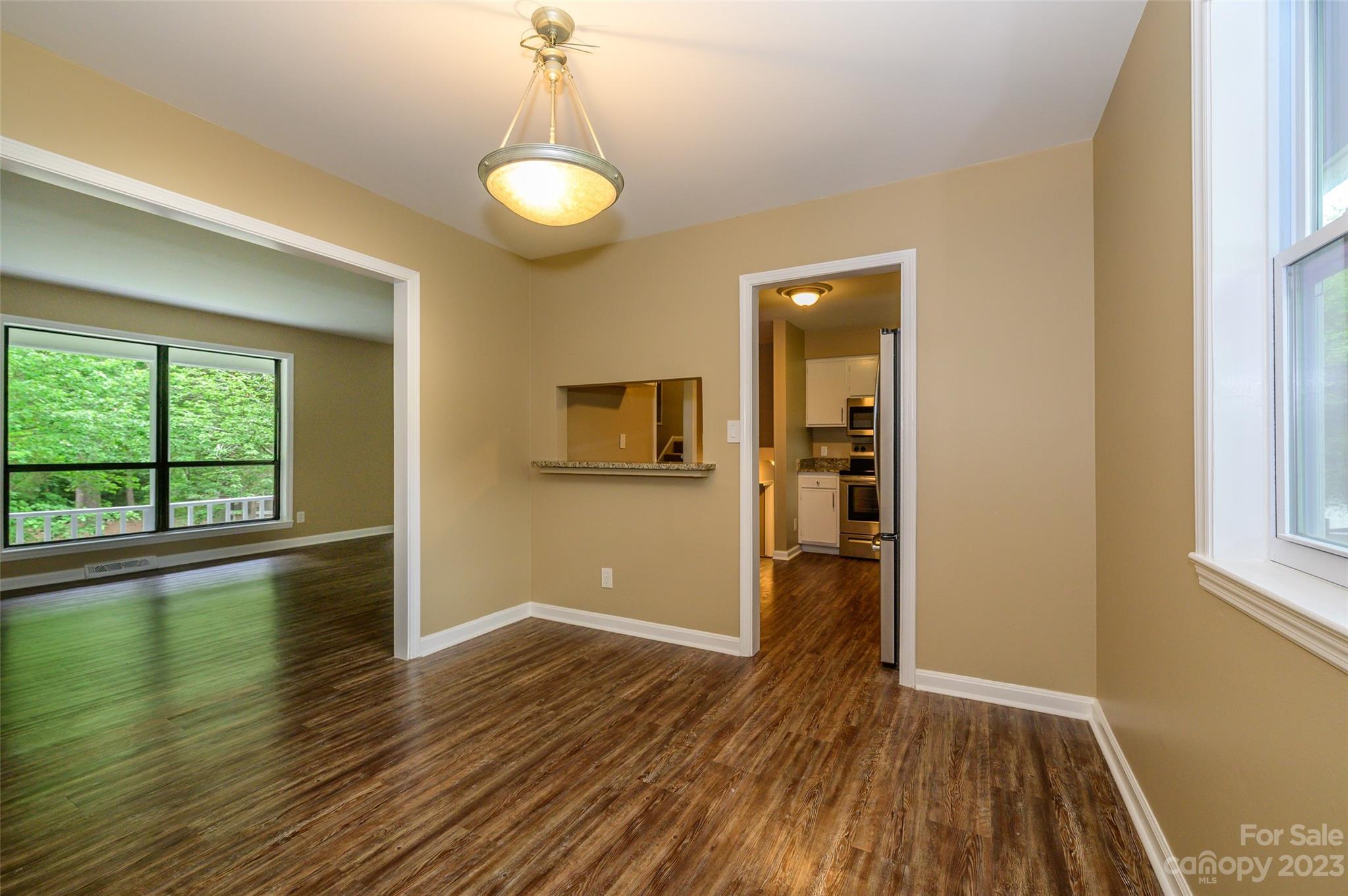16079 Molokai Drive Tega Cay, SC 29708 - Photo 14 of 41 a view of empty room with wooden floor and fan