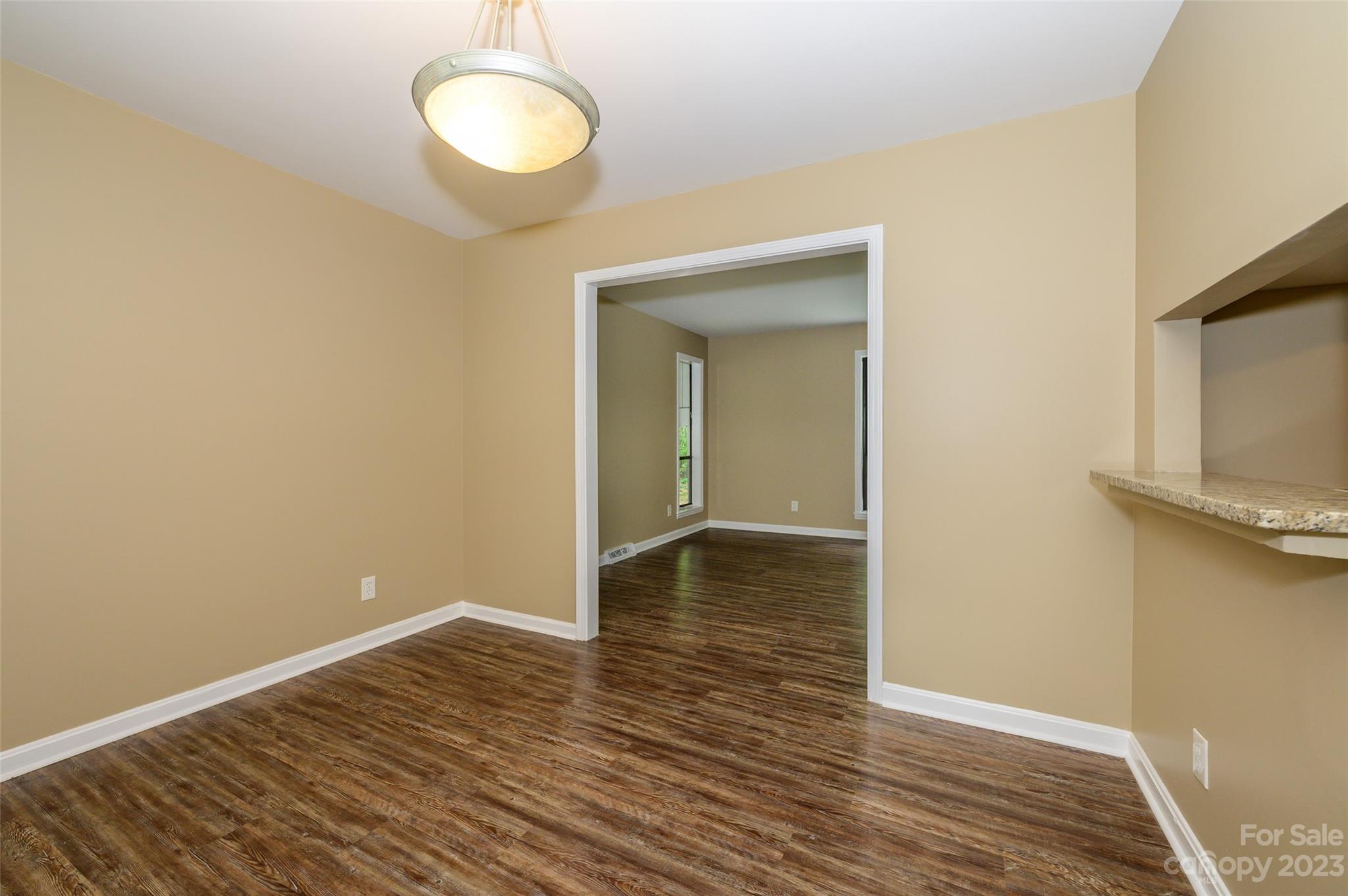 16079 Molokai Drive Tega Cay, SC 29708 - Photo 15 of 41 a view of a room with wooden floor and window