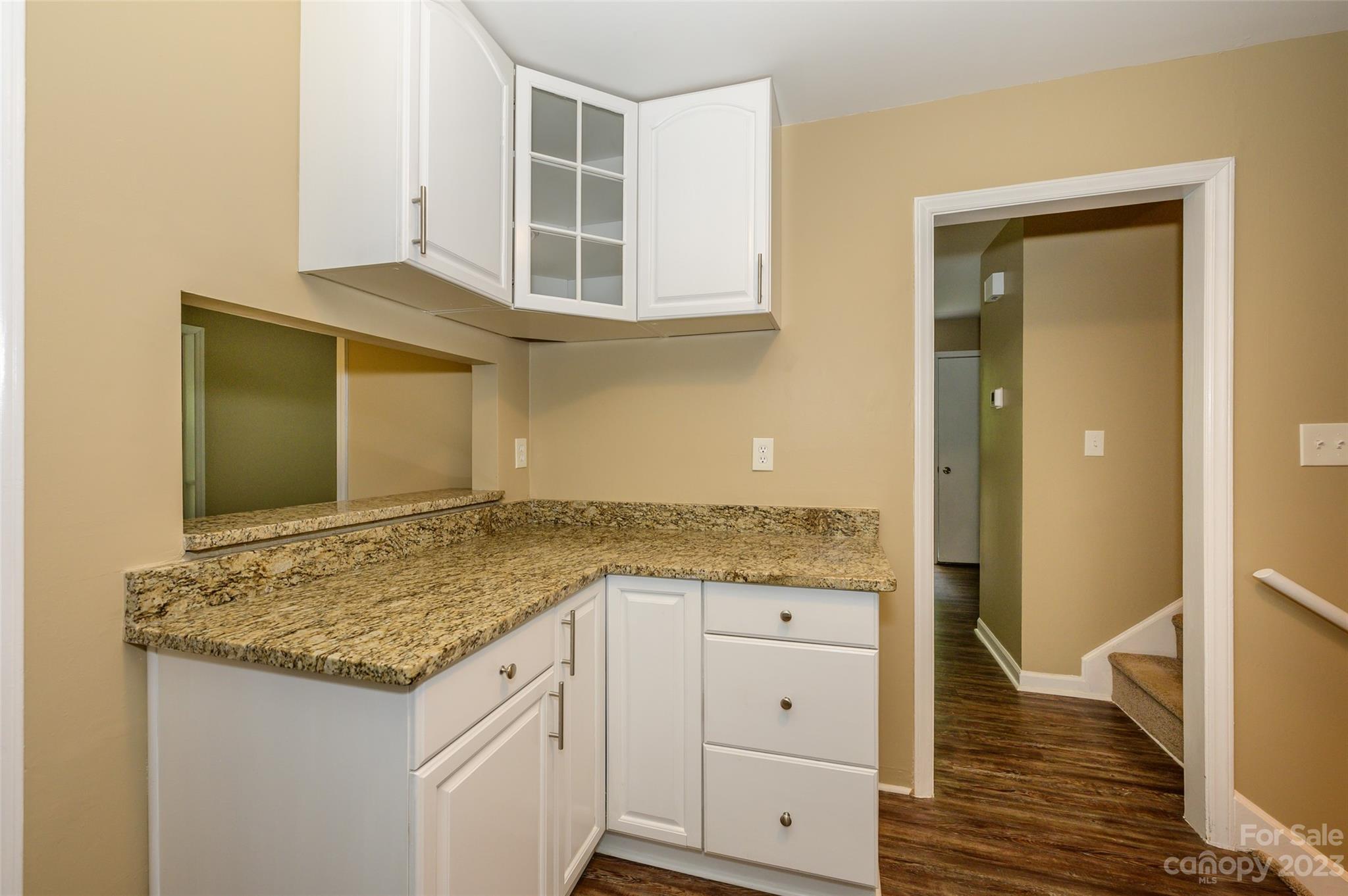 16079 Molokai Drive Tega Cay, SC 29708 - Photo 20 of 41 a view of cabinets and wooden floor
