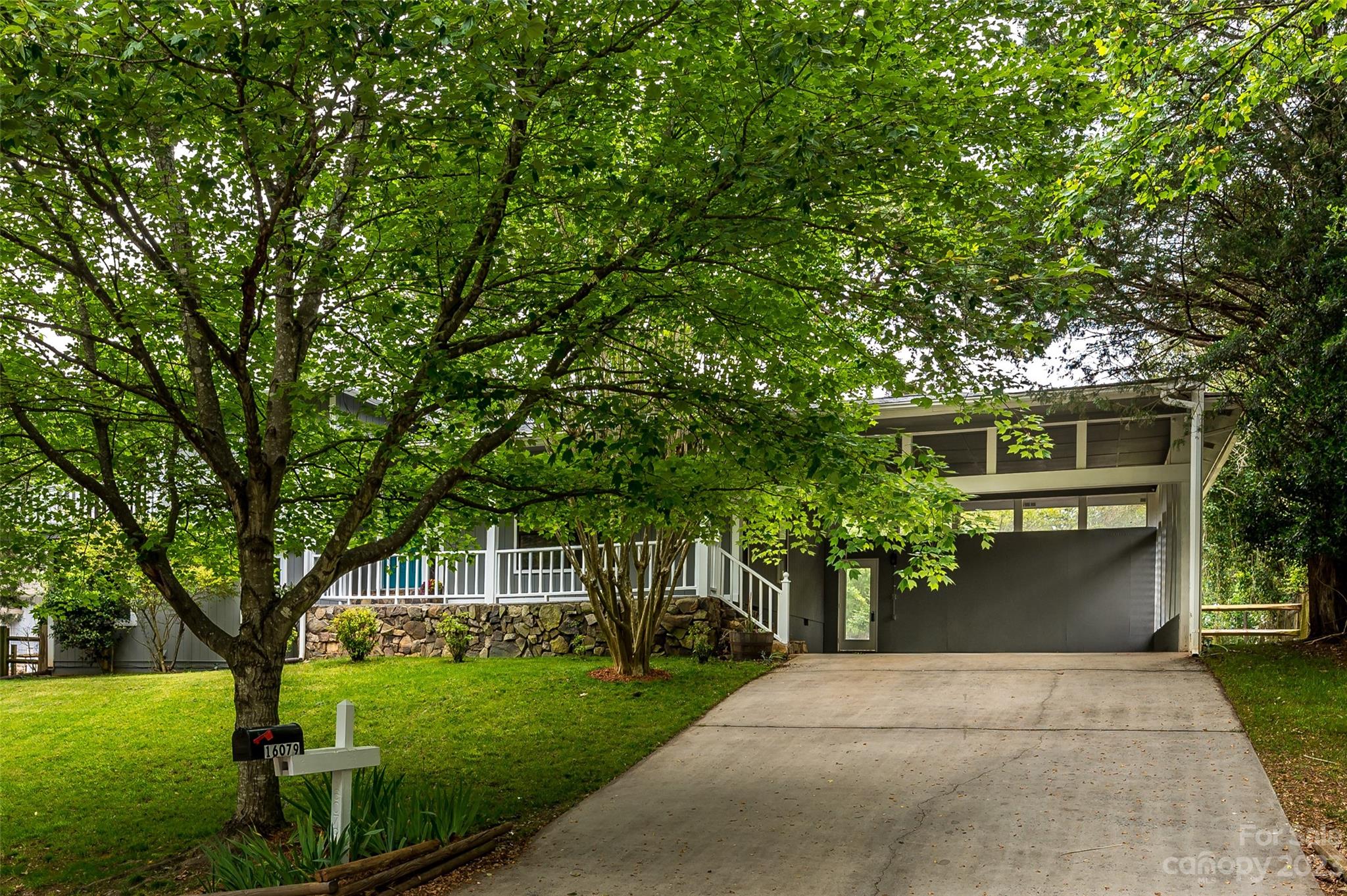 16079 Molokai Drive Tega Cay, SC 29708 - Photo 2 of 41 a front view of a house with garden