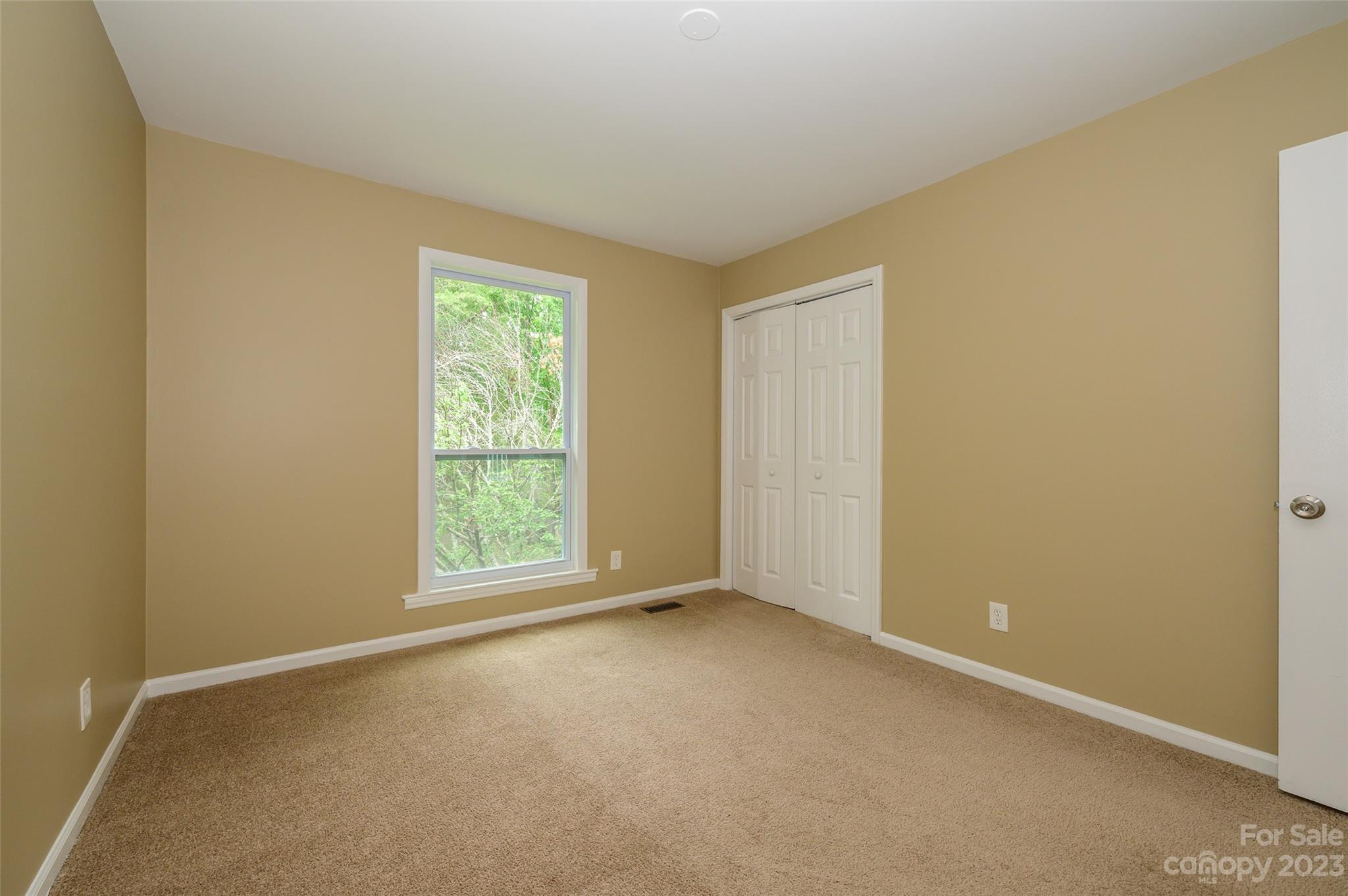 16079 Molokai Drive Tega Cay, SC 29708 - Photo 21 of 41 a view of an empty room with a window