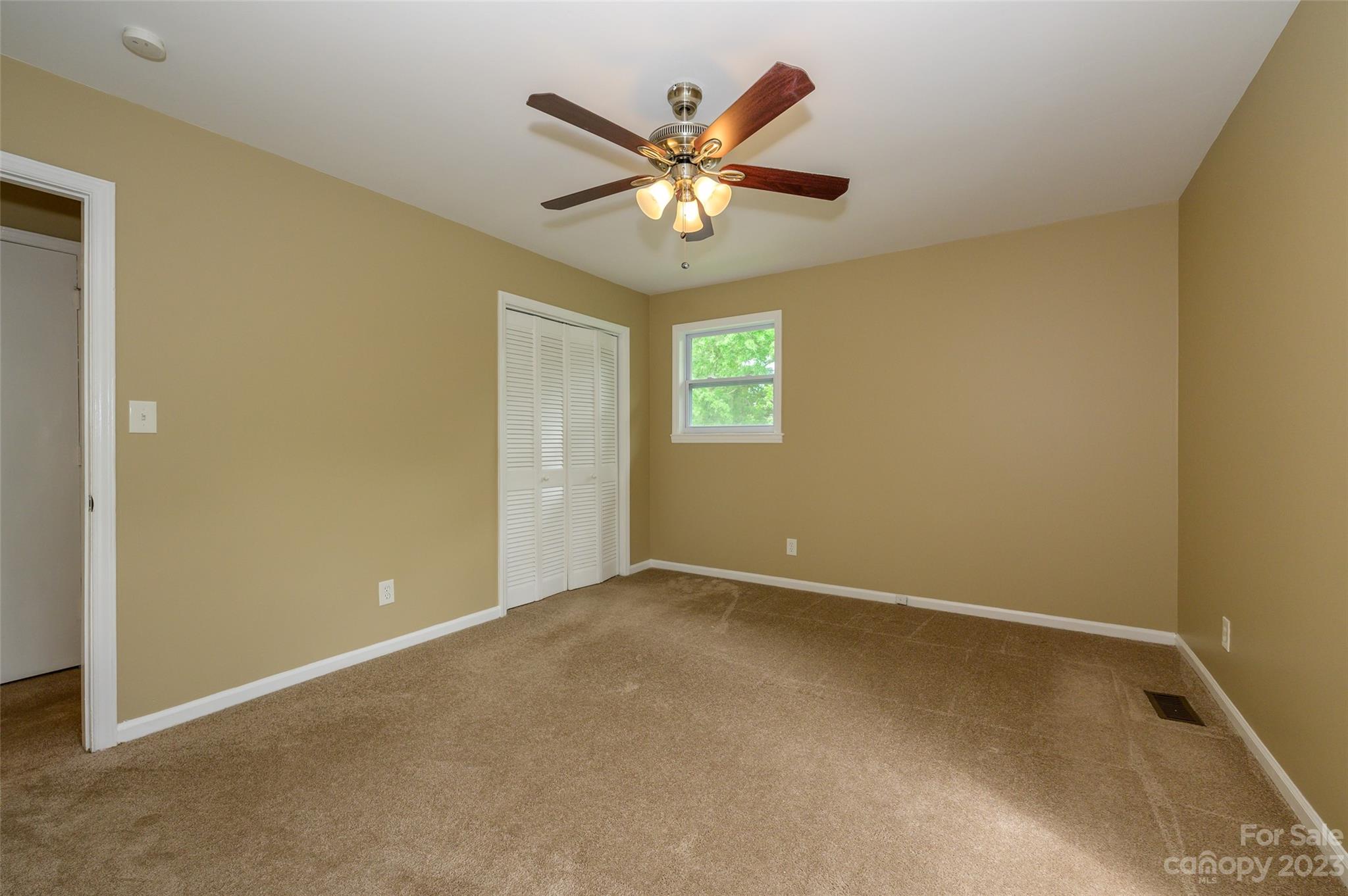 16079 Molokai Drive Tega Cay, SC 29708 - Photo 24 of 41 a view of an empty room with a window