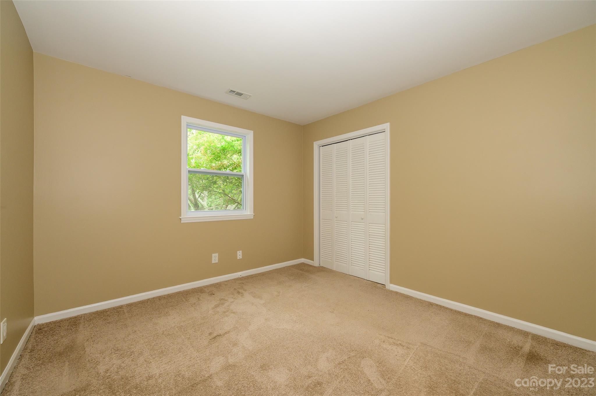 16079 Molokai Drive Tega Cay, SC 29708 - Photo 35 of 41 an empty room with windows