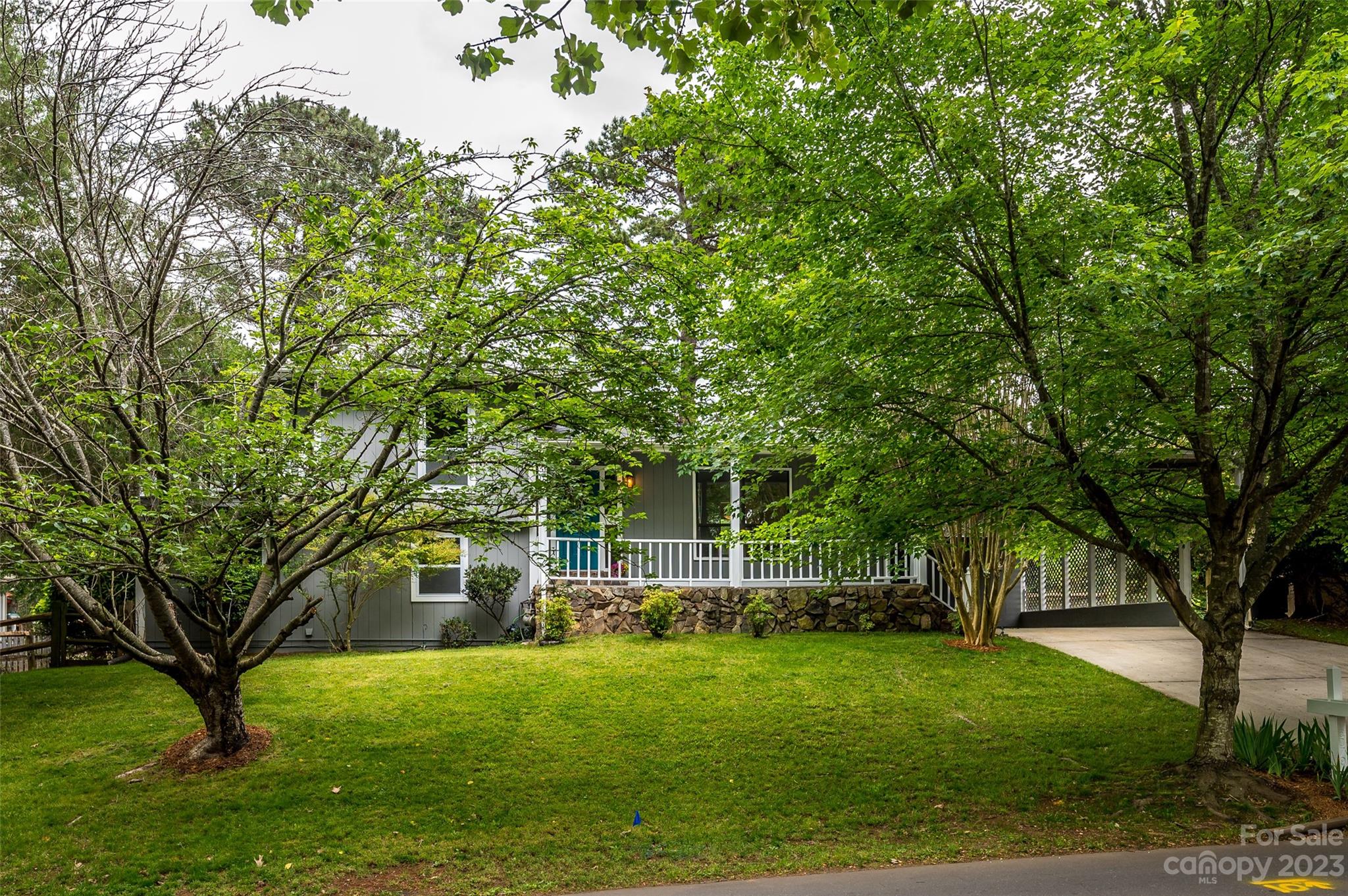 16079 Molokai Drive Tega Cay, SC 29708 - Photo 4 of 41 a front view of a house with a garden