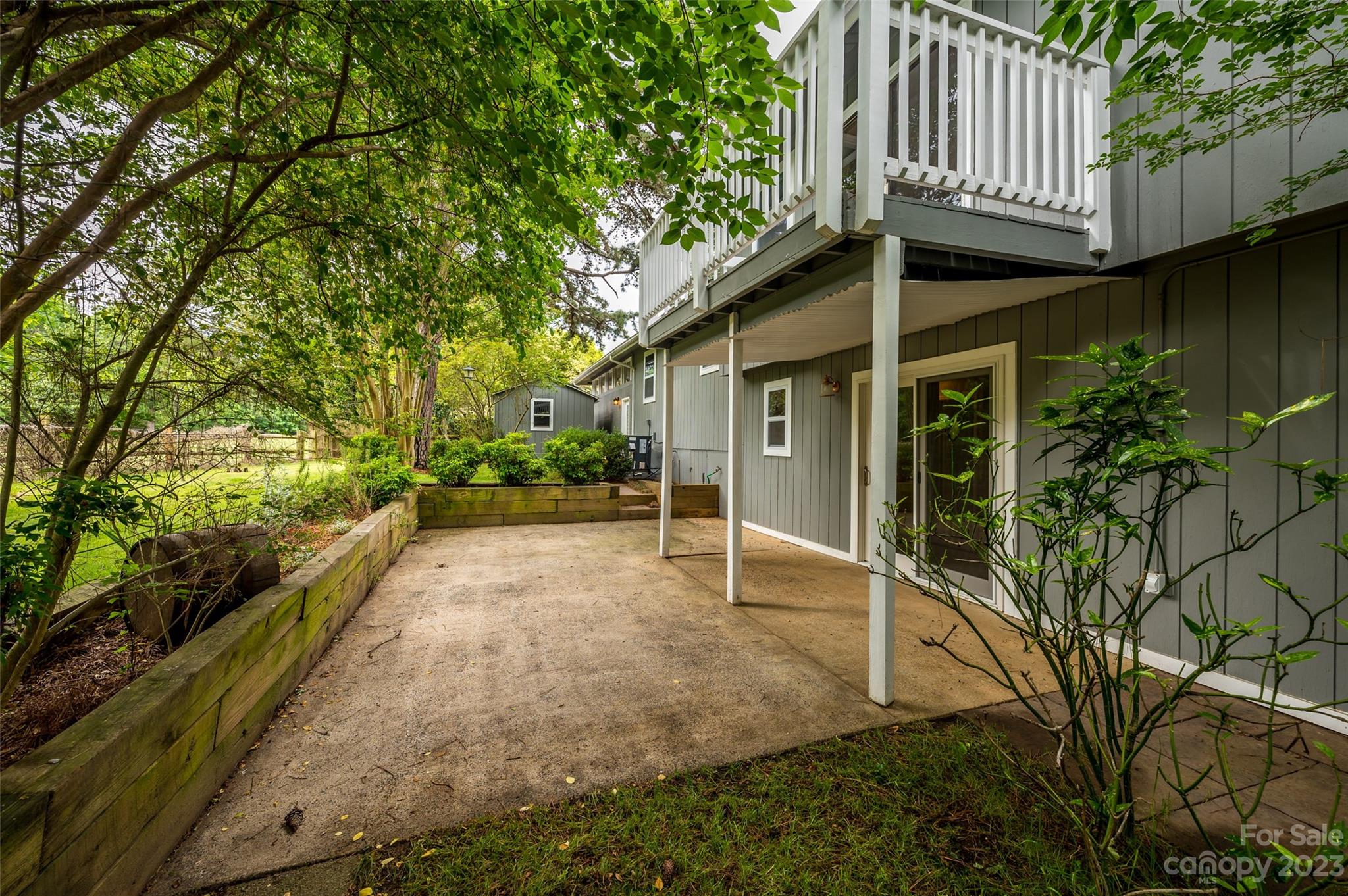 16079 Molokai Drive Tega Cay, SC 29708 - Photo 41 of 41 a view of a house with a yard and potted plants