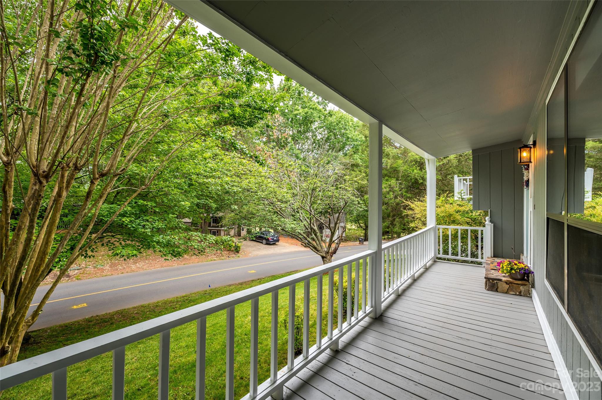 16079 Molokai Drive Tega Cay, SC 29708 - Photo 5 of 41 a view of balcony with floor to ceiling windows and wooden fence