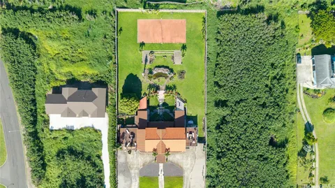 an aerial view of houses with yard