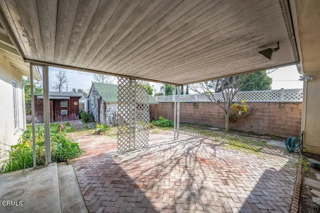 a view of a backyard with a tv