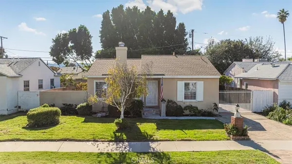 a view of house with yard swimming pool and outdoor seating
