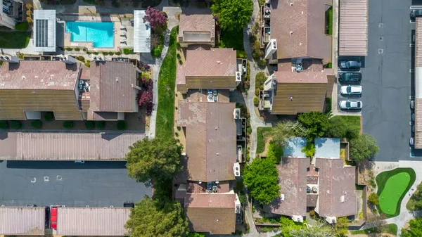 an aerial view of residential houses with outdoor space