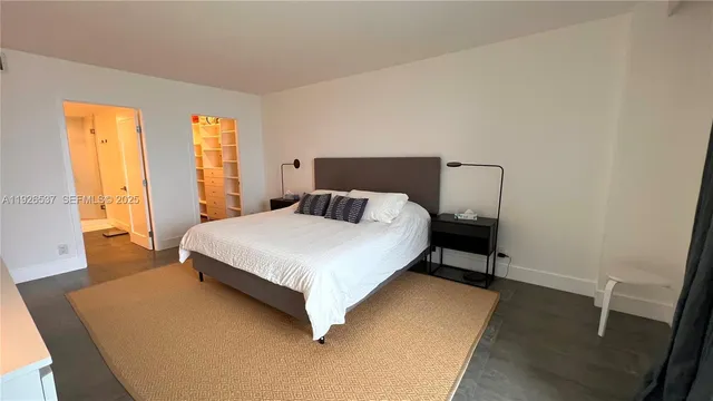 a bedroom with bed and window