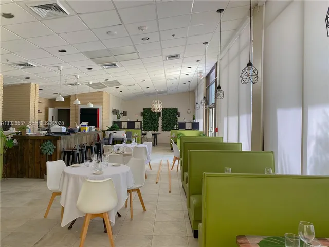 a couple of palm trees in front of a building