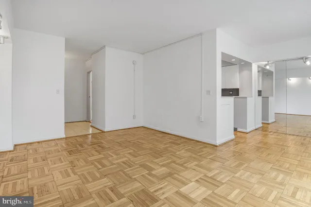 a building with cars parked on the road