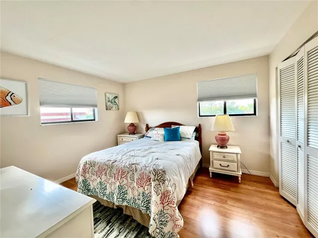 a bed room with a bed and a window