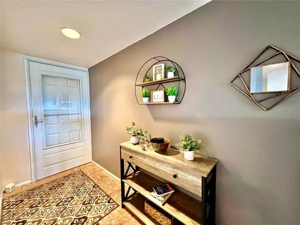 a view of a livingroom with furniture and window