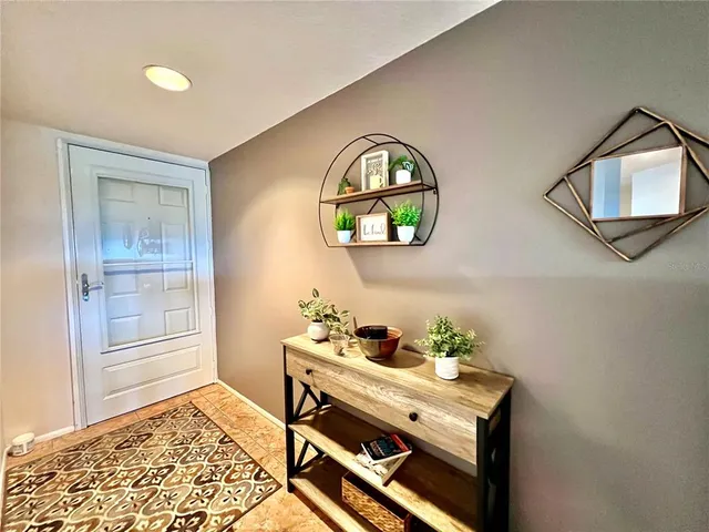 a view of a livingroom with furniture and window