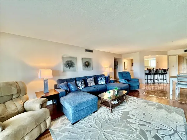 a living room with furniture and a table