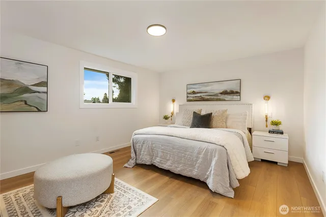 a bedroom with a large bed and a window