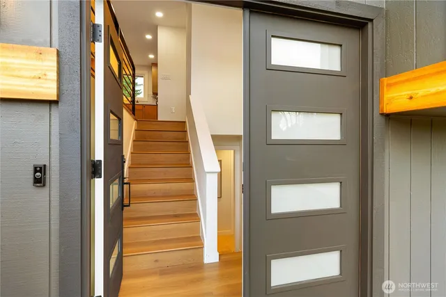 a view of an entryway with wooden floor