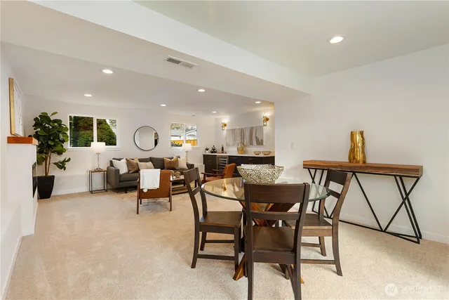 a living room with furniture kitchen view and a dining table