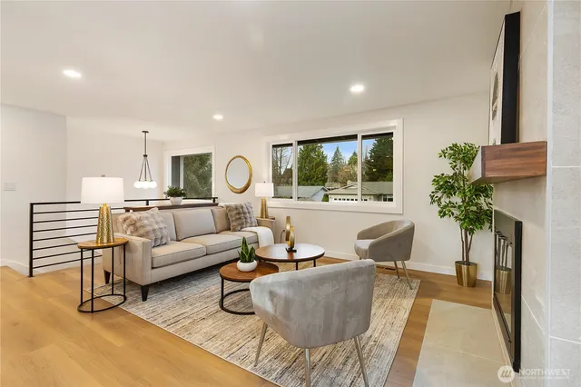 a living room with furniture and a potted plant