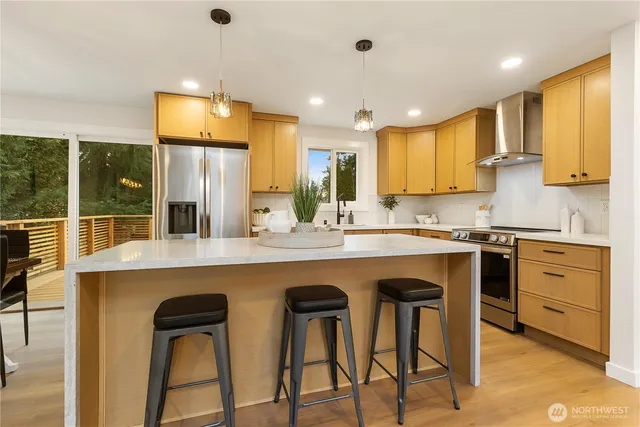 a kitchen with counter top space and appliances