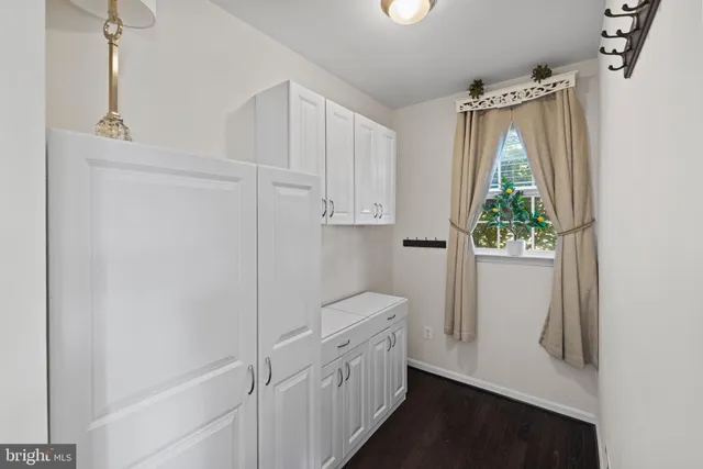 a bathroom with a bathtub and a window