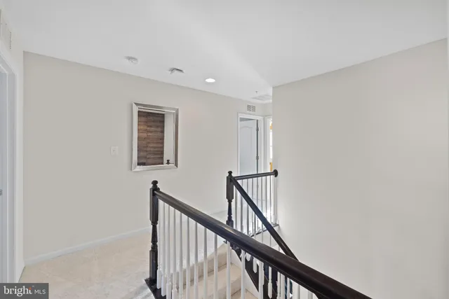 a view of a hallway with stairs