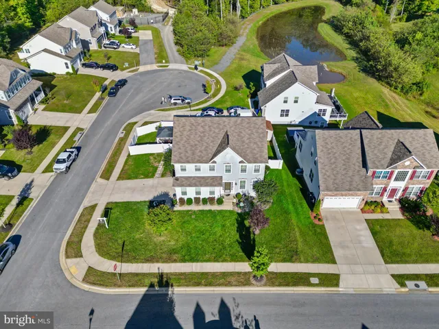 an aerial view of residential house with outdoor space and swimming pool