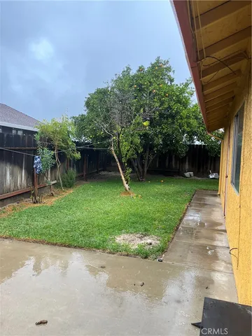 a view of a backyard with a small cabin