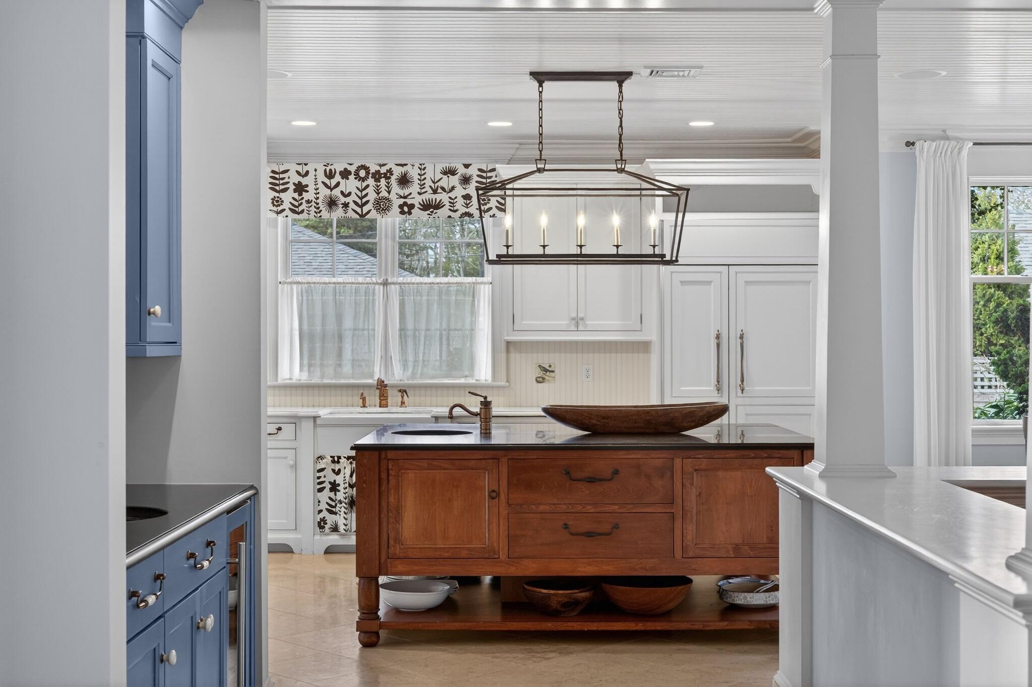 268 Parker Road Osterville, MA 02655 - Photo 8 of 18 a room with a table chairs and chandelier