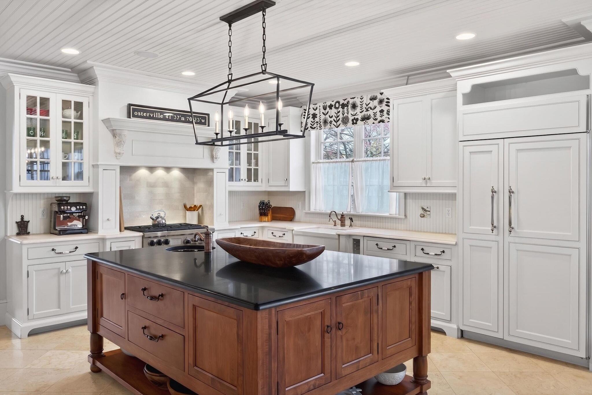 268 Parker Road Osterville, MA 02655 - Photo 9 of 18 a kitchen with stainless steel appliances granite countertop a sink and white cabinets
