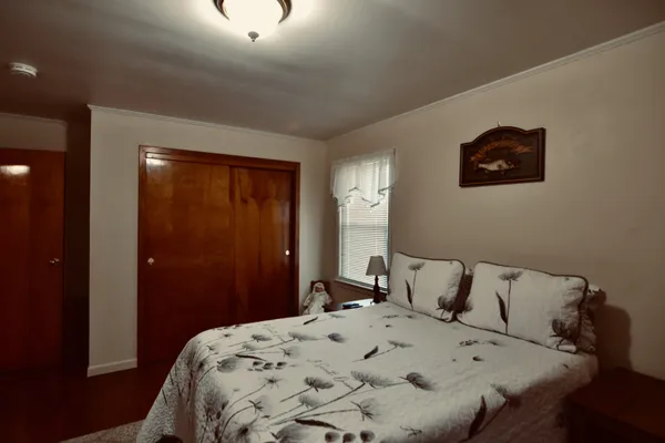 a bedroom with a bed and a table