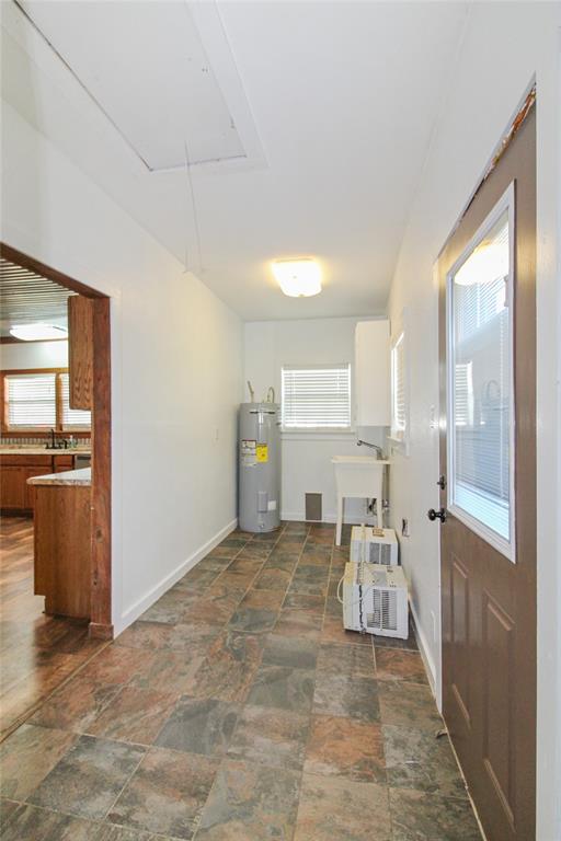 455 Hughes Cemetery Road Italy, TX 76651 - Photo 33 of 40 a view of a kitchen with furniture and an empty room