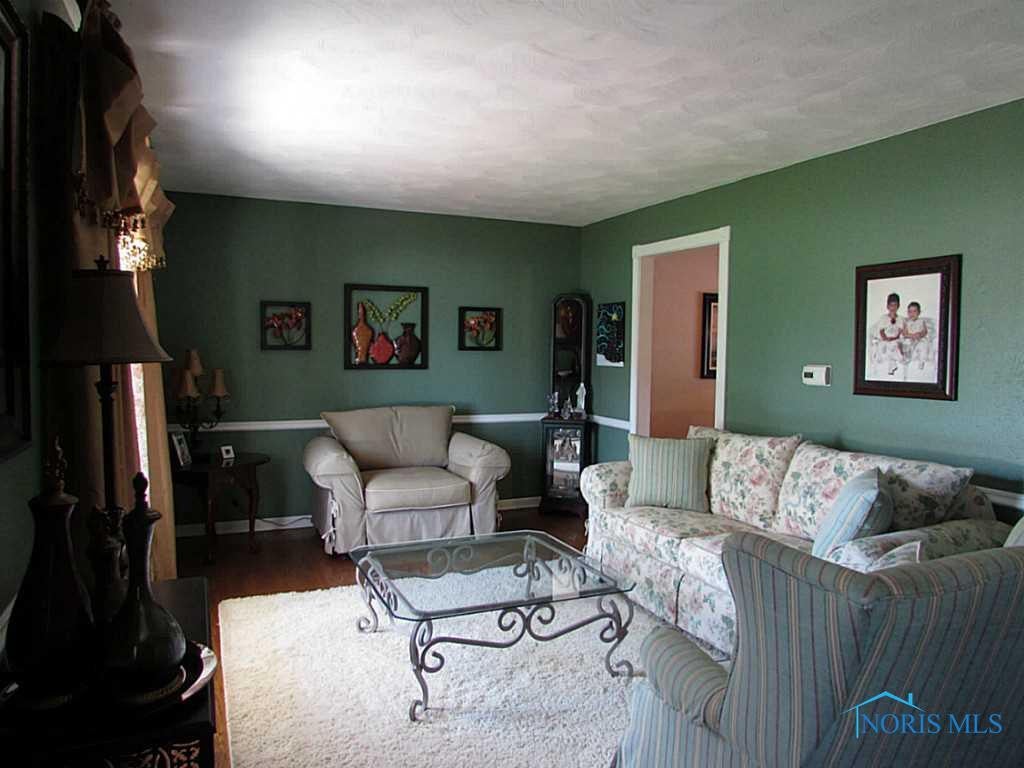 462 Eagle Point Road Rossford, OH 43460 - Photo 8 of 19 Living Room. Living room with white trim, todays colors and wood floors!