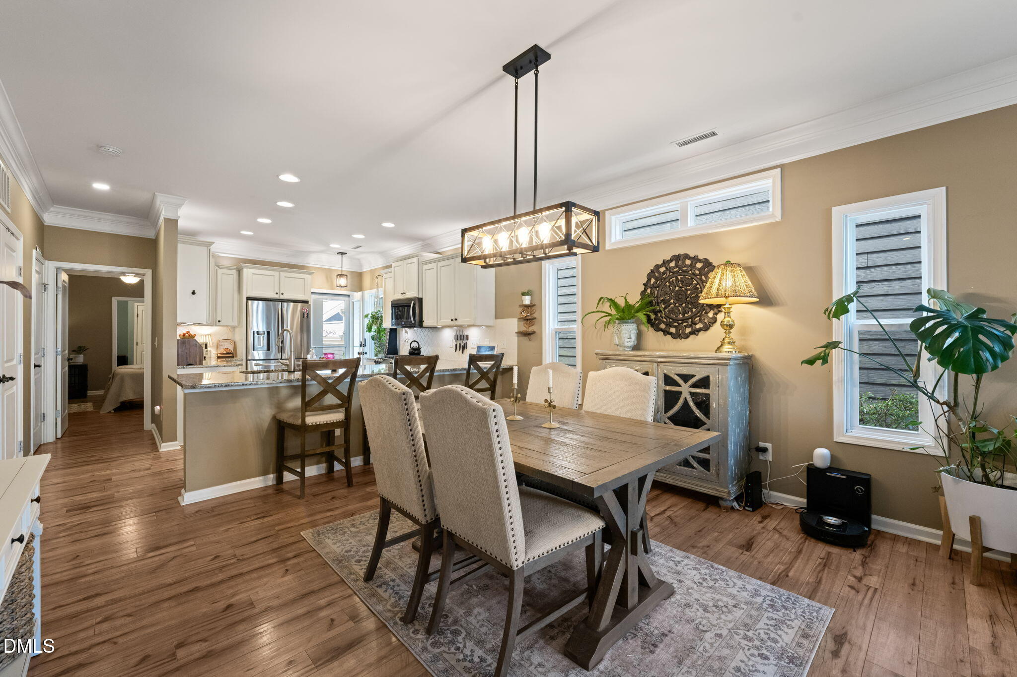 1716 Main Divide Drive Wake Forest, NC 27587 - Photo 10 of 45 a view of a dining room with furniture and wooden floor