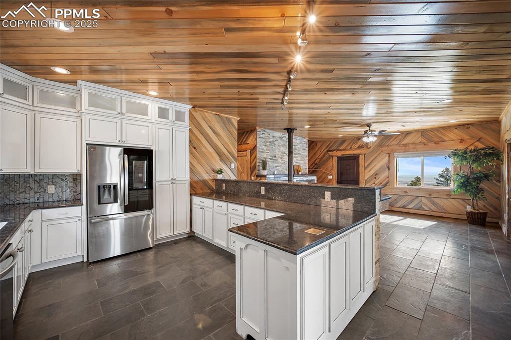 10739 Arnold Lane Rye, CO 81069 - Photo 11 of 50 a kitchen with stainless steel appliances granite countertop a sink and a stove