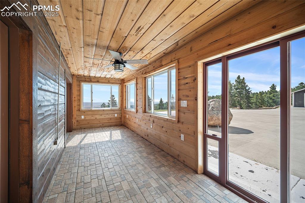 10739 Arnold Lane Rye, CO 81069 - Photo 35 of 50 a view of hallway with a large window and chandelier