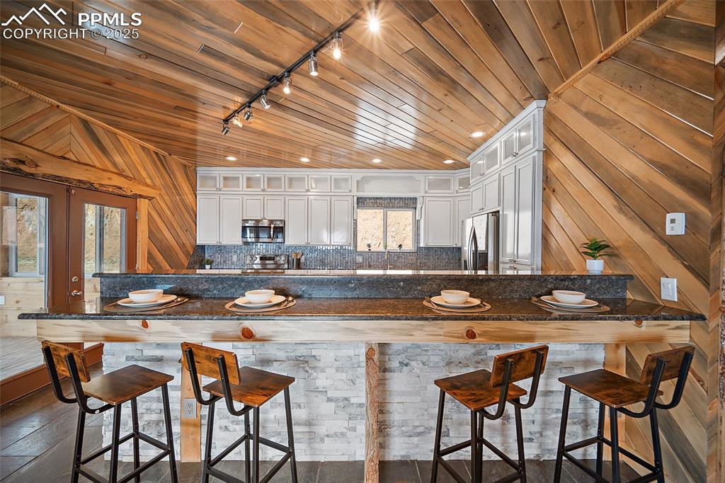 10739 Arnold Lane Rye, CO 81069 - Photo 5 of 50 a dining room with furniture and wooden floor