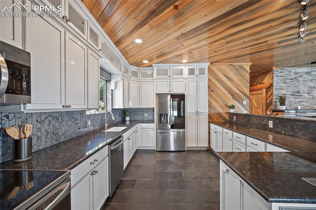 10739 Arnold Lane Rye, CO 81069 - Photo 10 of 50 a kitchen with a sink and cabinets