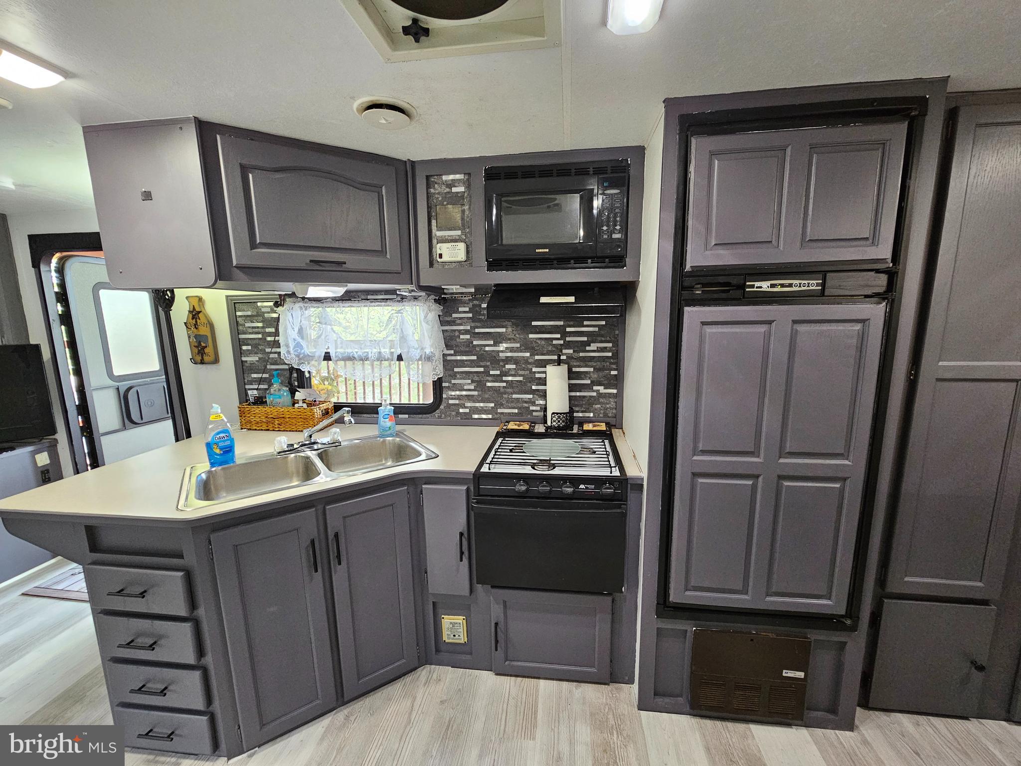 39 & 40 Hot Dog Road Falling Waters, WV 25419 - Photo 13 of 39 a kitchen with a sink appliances and cabinets