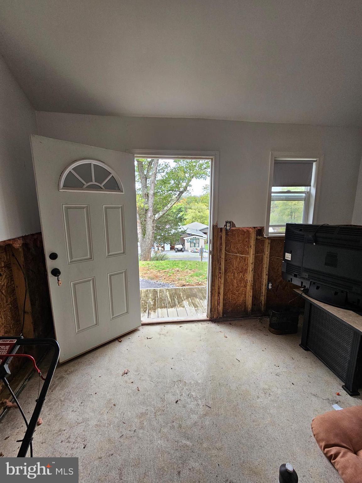 39 & 40 Hot Dog Road Falling Waters, WV 25419 - Photo 23 of 39 a view of an empty room with a fireplace and a window