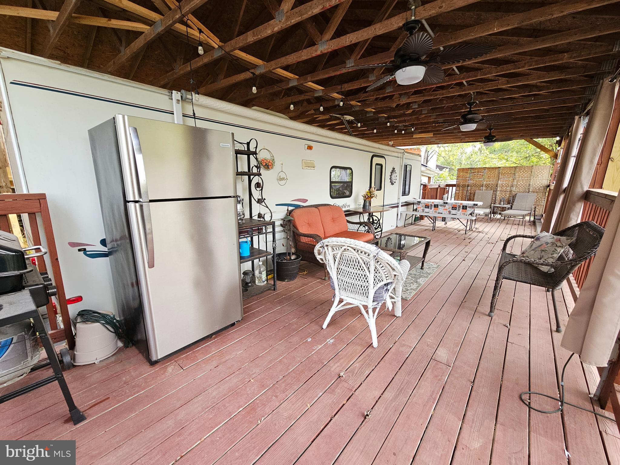 39 & 40 Hot Dog Road Falling Waters, WV 25419 - Photo 6 of 39 a view of a kitchen with furniture and a refrigerator