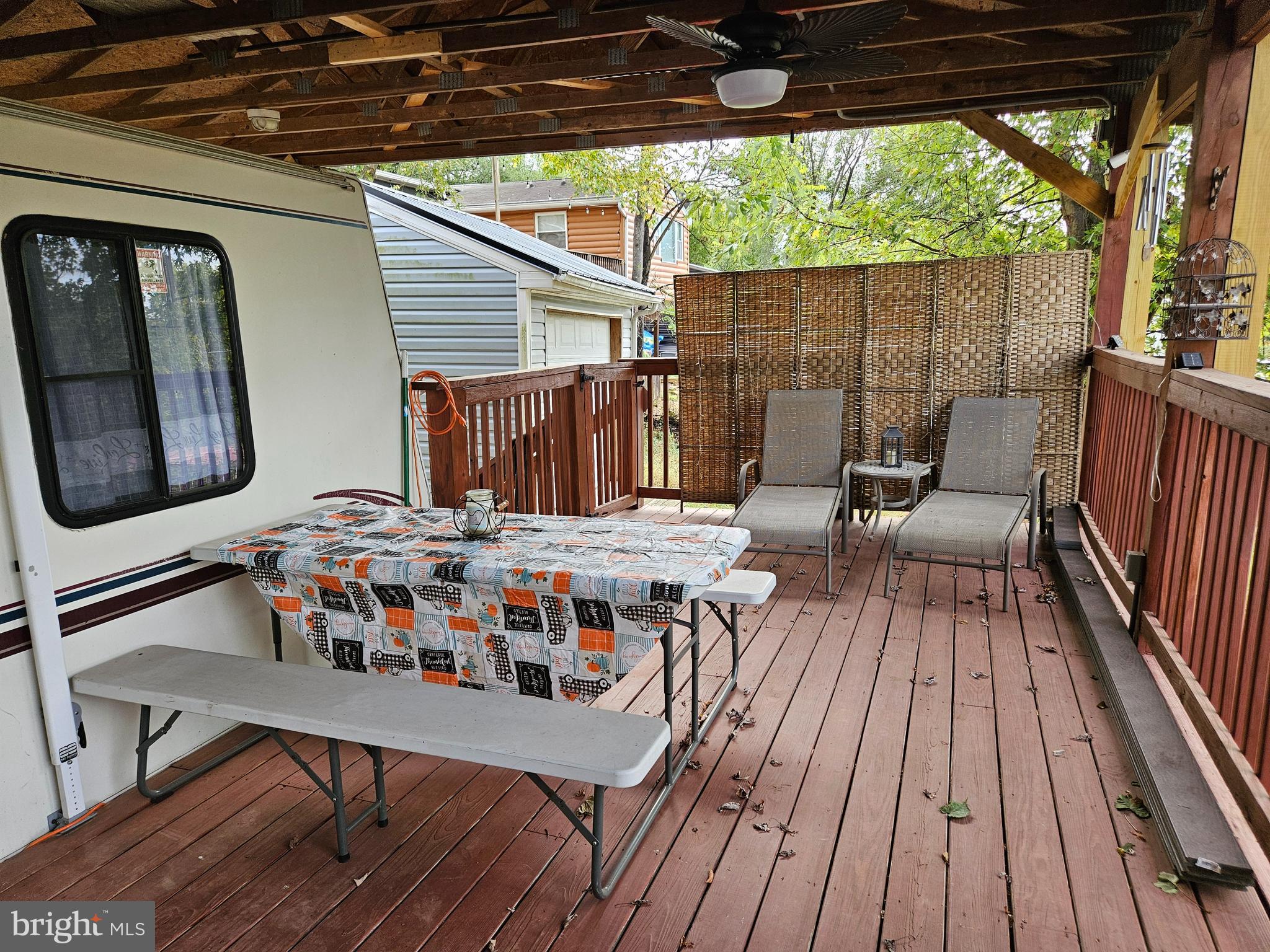 39 & 40 Hot Dog Road Falling Waters, WV 25419 - Photo 8 of 39 a view of a chairs and table on the roof deck