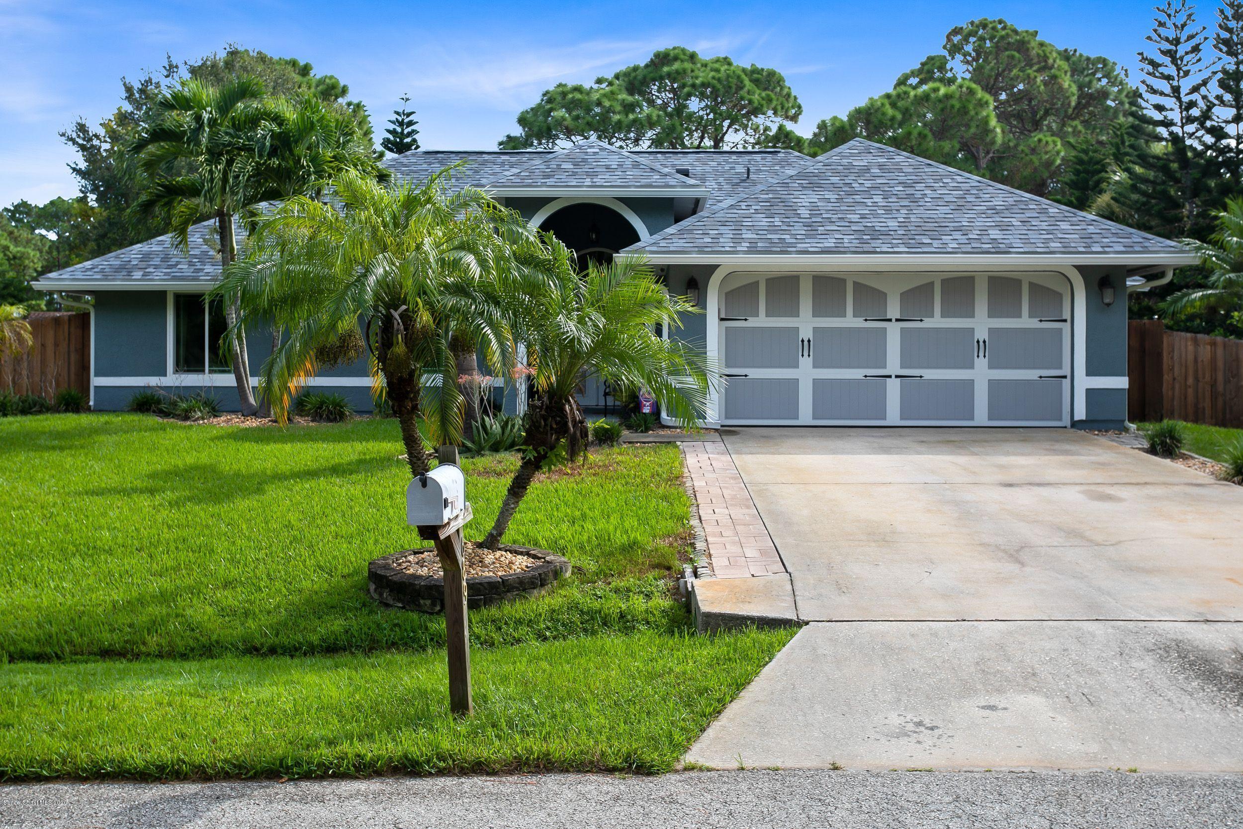 689 Bryant Road Palm Bay, FL 32908 - Photo 2 of 27 a house view with a garden space