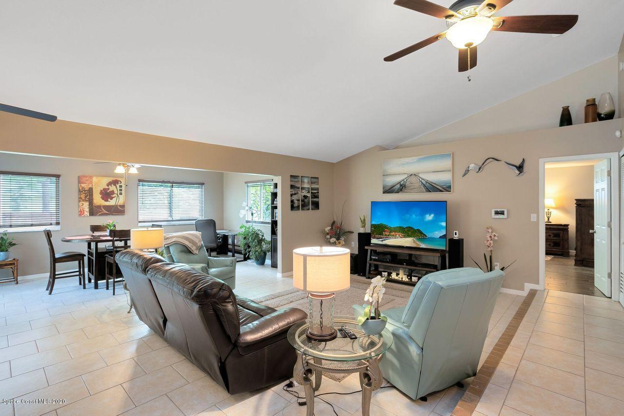 689 Bryant Road Palm Bay, FL 32908 - Photo 11 of 27 a living room with furniture and a fireplace