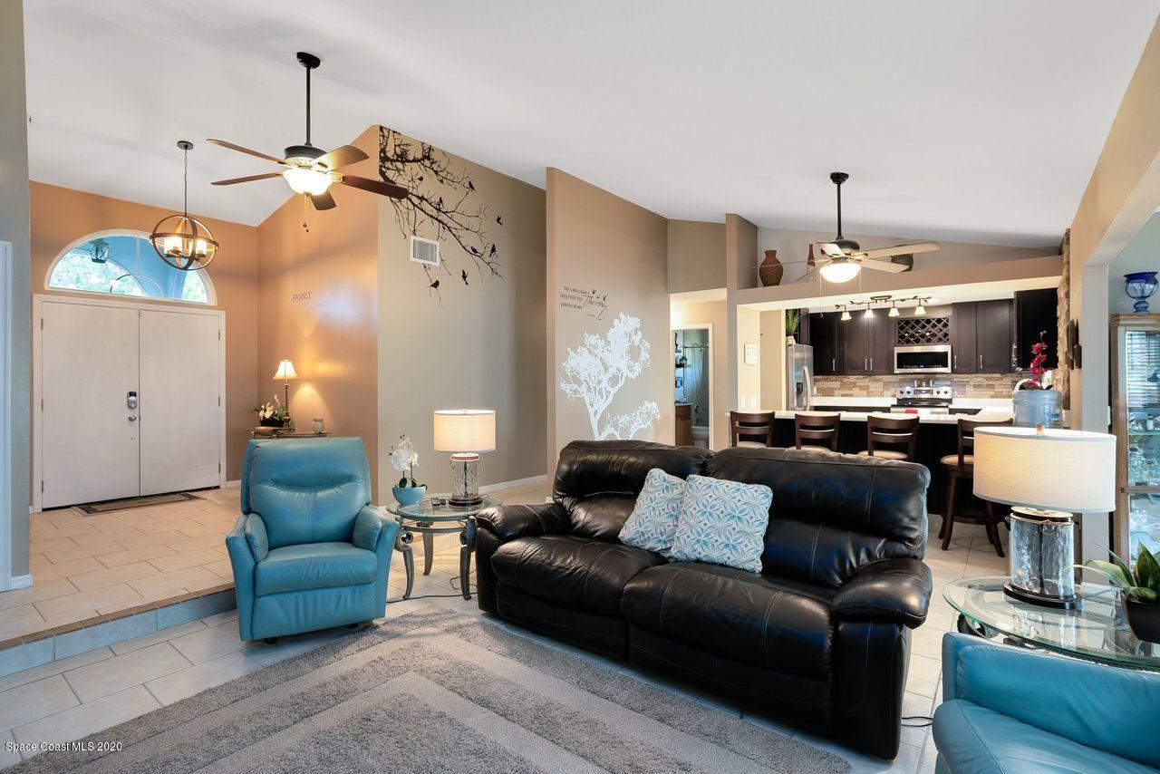 689 Bryant Road Palm Bay, FL 32908 - Photo 12 of 27 a living room with furniture and kitchen view